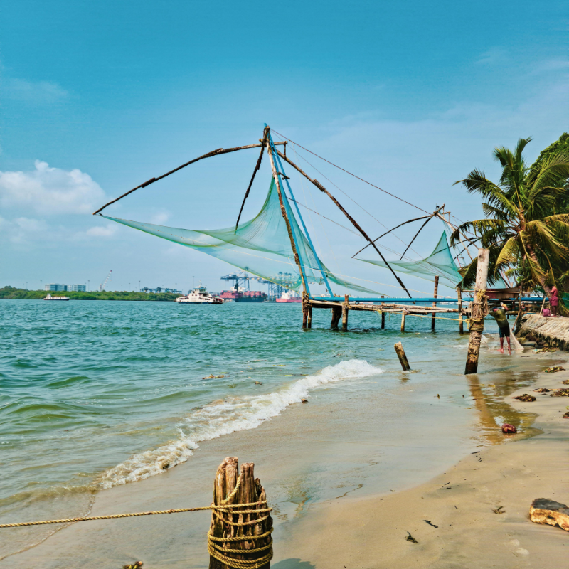 Large cantilevered Chinese fishing nets at sunset in Fort Kochi