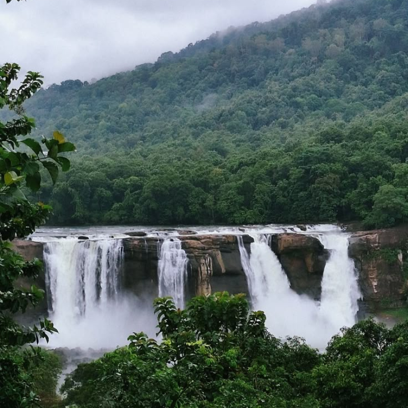 The wide and powerful Athirappilly waterfall cascading down rocks