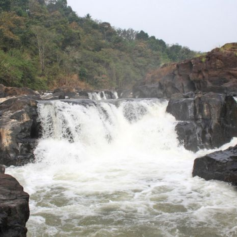 Wide panoramic view of Perunthenaruvi rocky waterfall