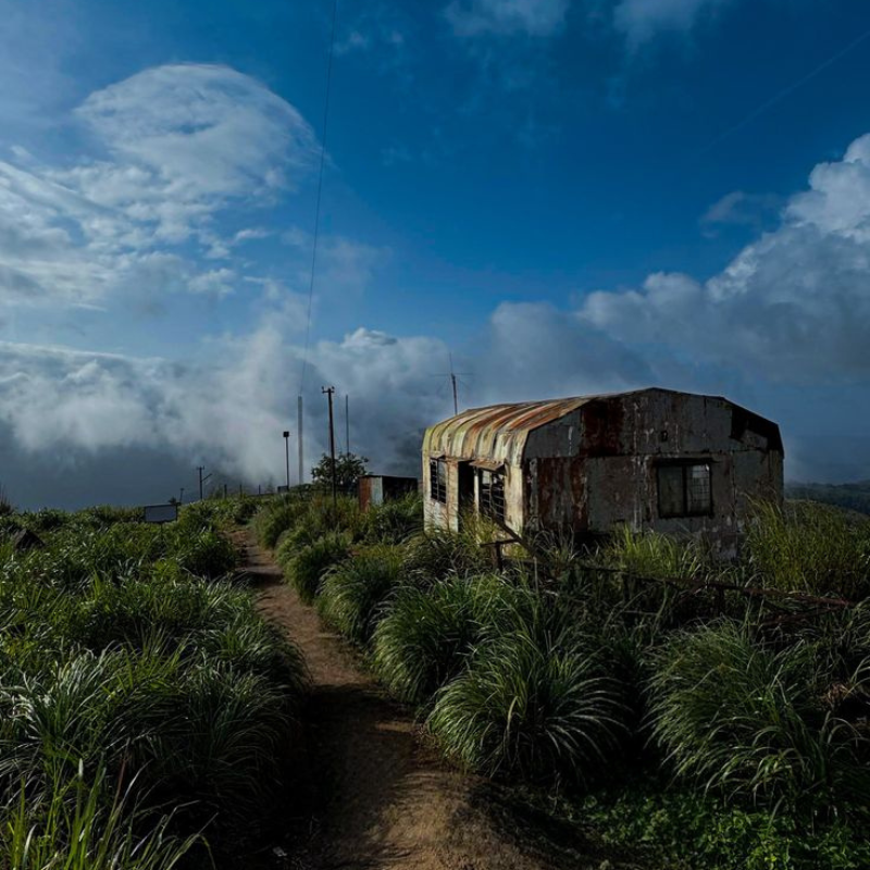 High altitude grassy hills of Ilaveezhapoonchira under a cloudy sky