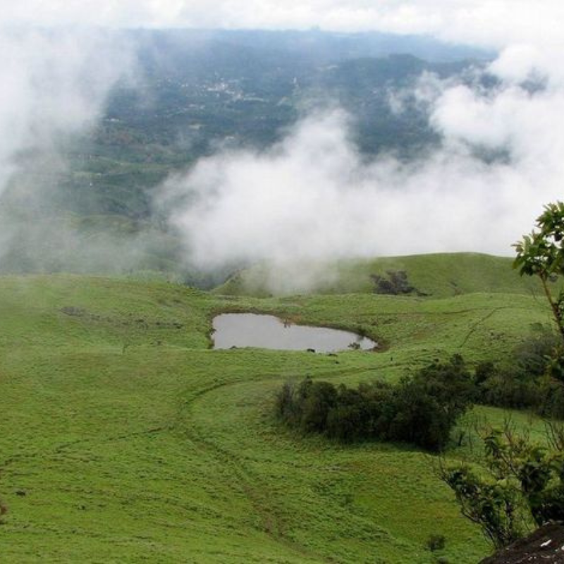 Panoramic view of the perennial heart-shaped lake on the way to Chembra Peak.