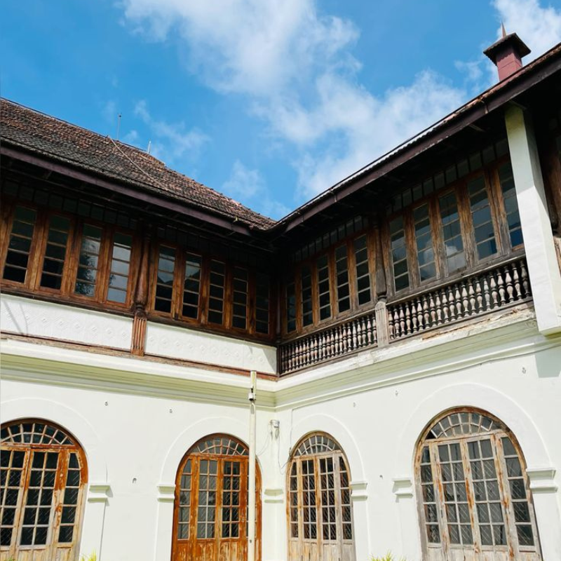 The sprawling white building of Hill Palace Museum in Thripunithura
