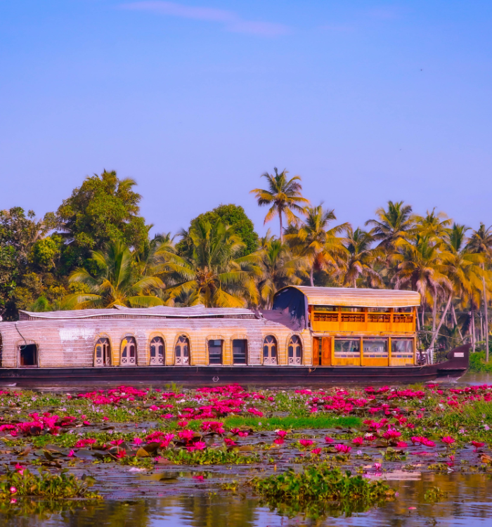 Luxury Kerala houseboat cruising through palm-fringed Alleppey backwaters