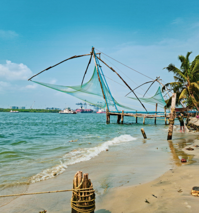 Large cantilevered Chinese fishing nets at sunset in Fort Kochi