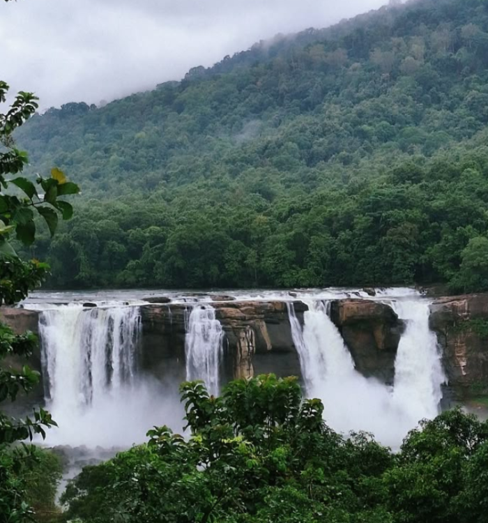 The wide and powerful Athirappilly waterfall cascading down rocks