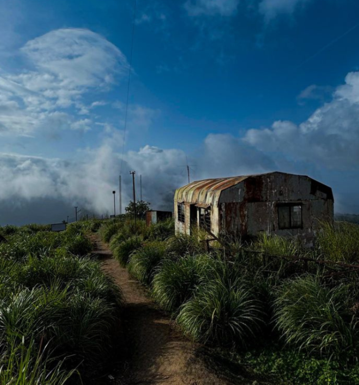 High altitude grassy hills of Ilaveezhapoonchira under a cloudy sky