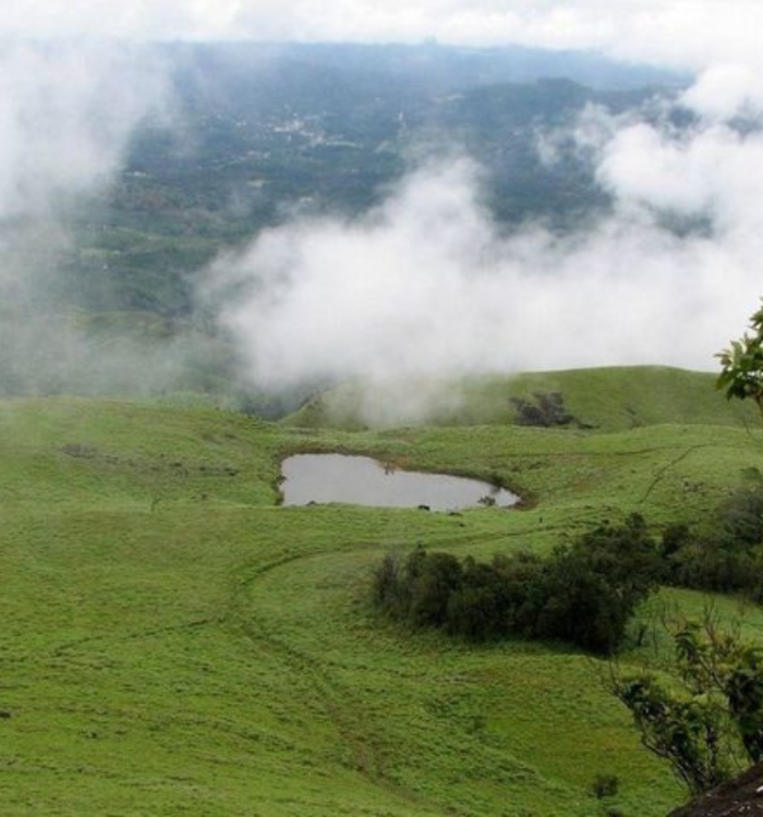 Panoramic view of the perennial heart-shaped lake on the way to Chembra Peak.