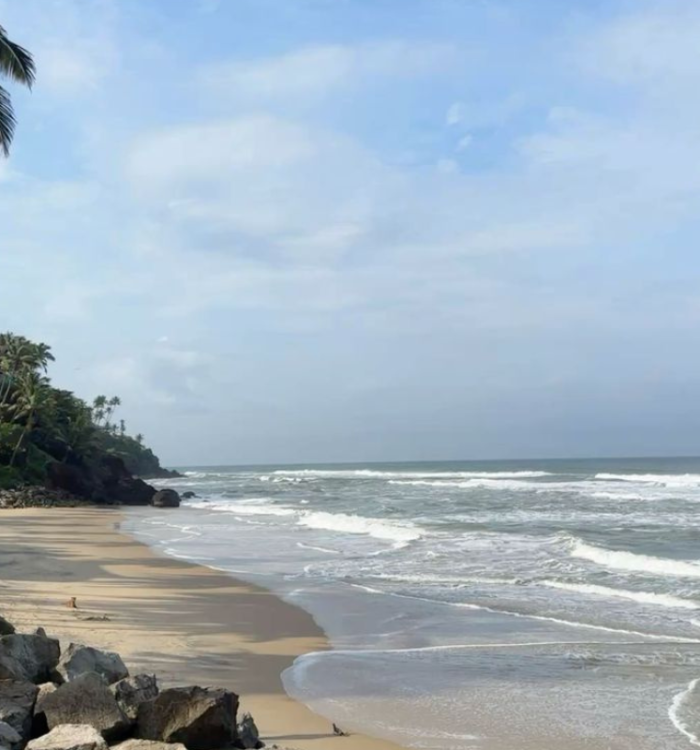 Clean shoreline and beach park at Snehatheeram Beach Thrissur