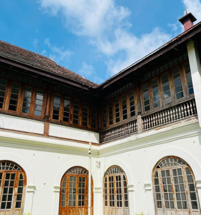 The sprawling white building of Hill Palace Museum in Thripunithura