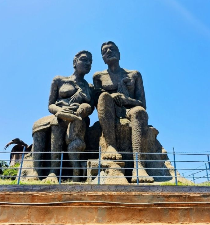 Large stone statues at Ramakkalmedu viewpoint overlooking the valley